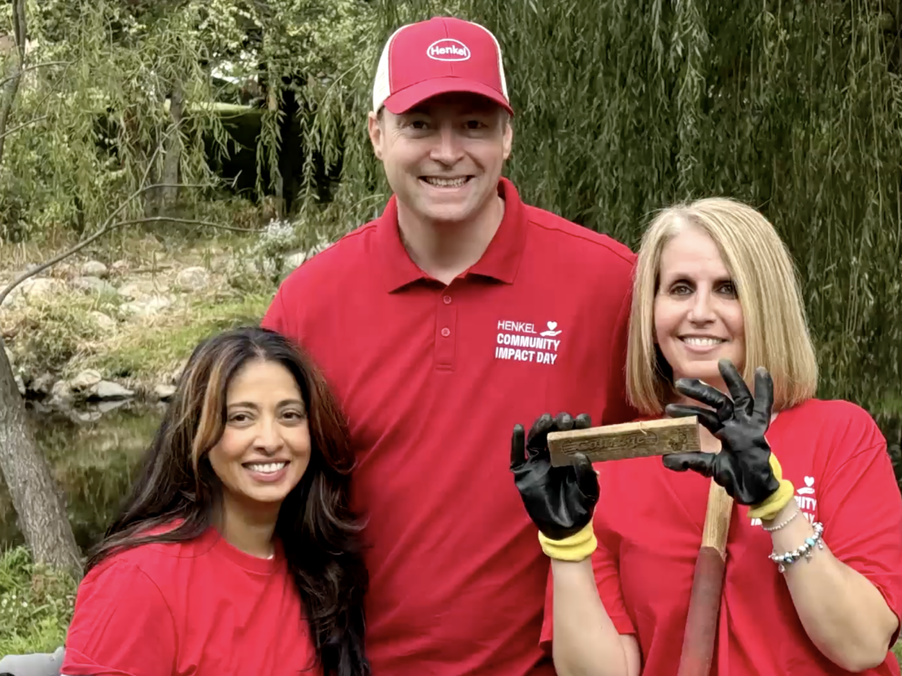 Three volunteers smiling
