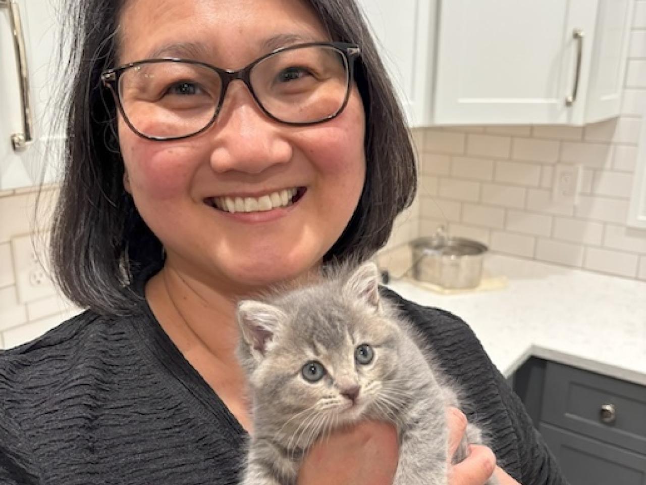 Holly holding a kitten.