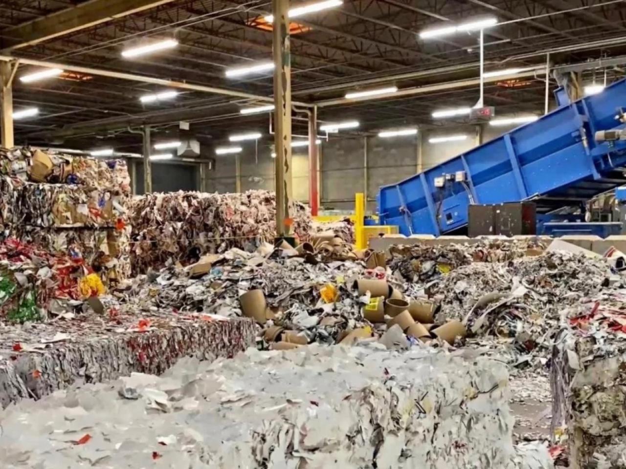 Truck dropping off a load at recycling facility