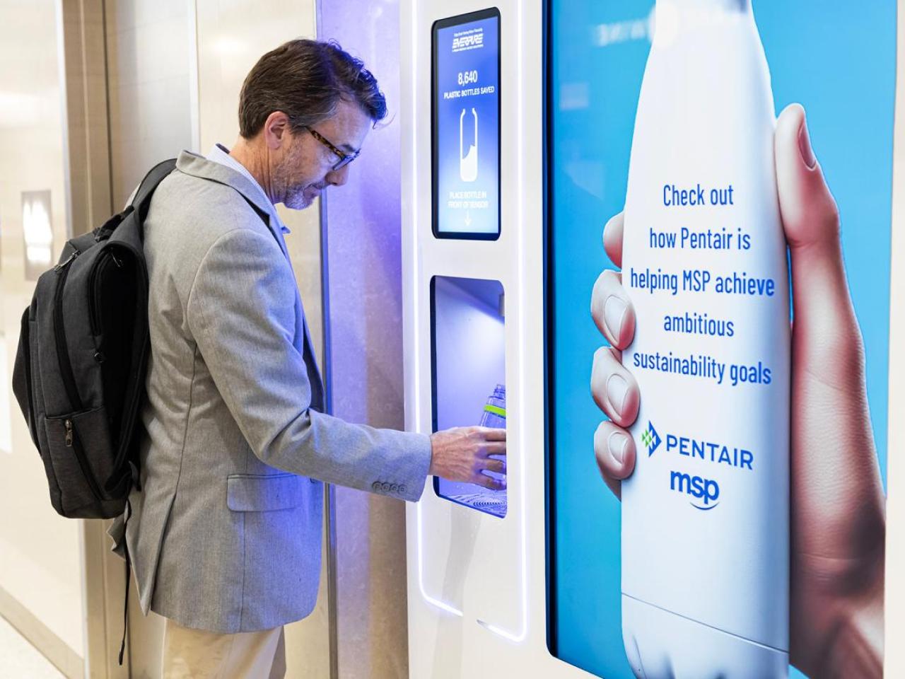 Man filling water bottle