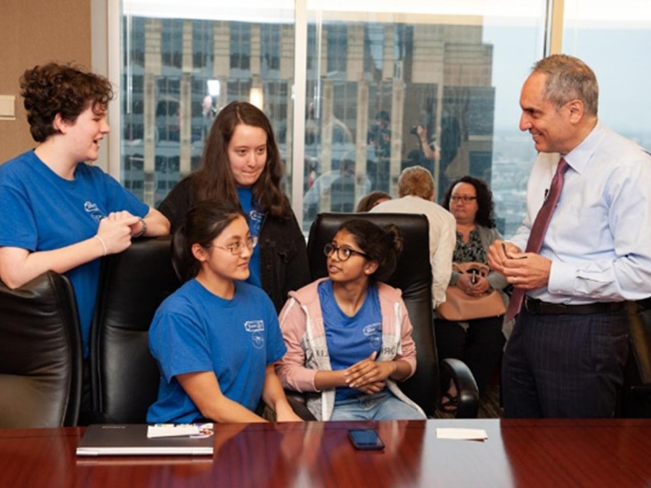 Members of the Computer Glitz team from left — Clare Dixon, Ellie Sprinthall, Ashley Chen and Prapthi Jayesh Sirrkay — with U.S. Bank CEO Andy Cecere at a 2018 Technovation event.