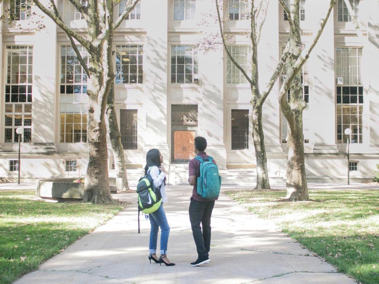 people walking on a college campus