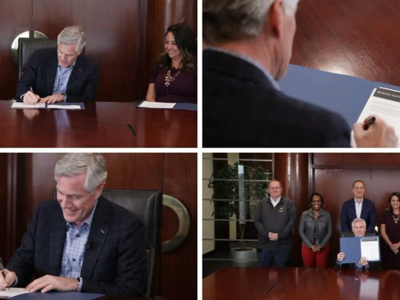 Collage of four photos of the CEO seated, signing a document at a large wood desk. A group of 5 people behind them.