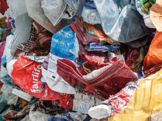 Plastic waste shown in the process of being sorted for recycling.