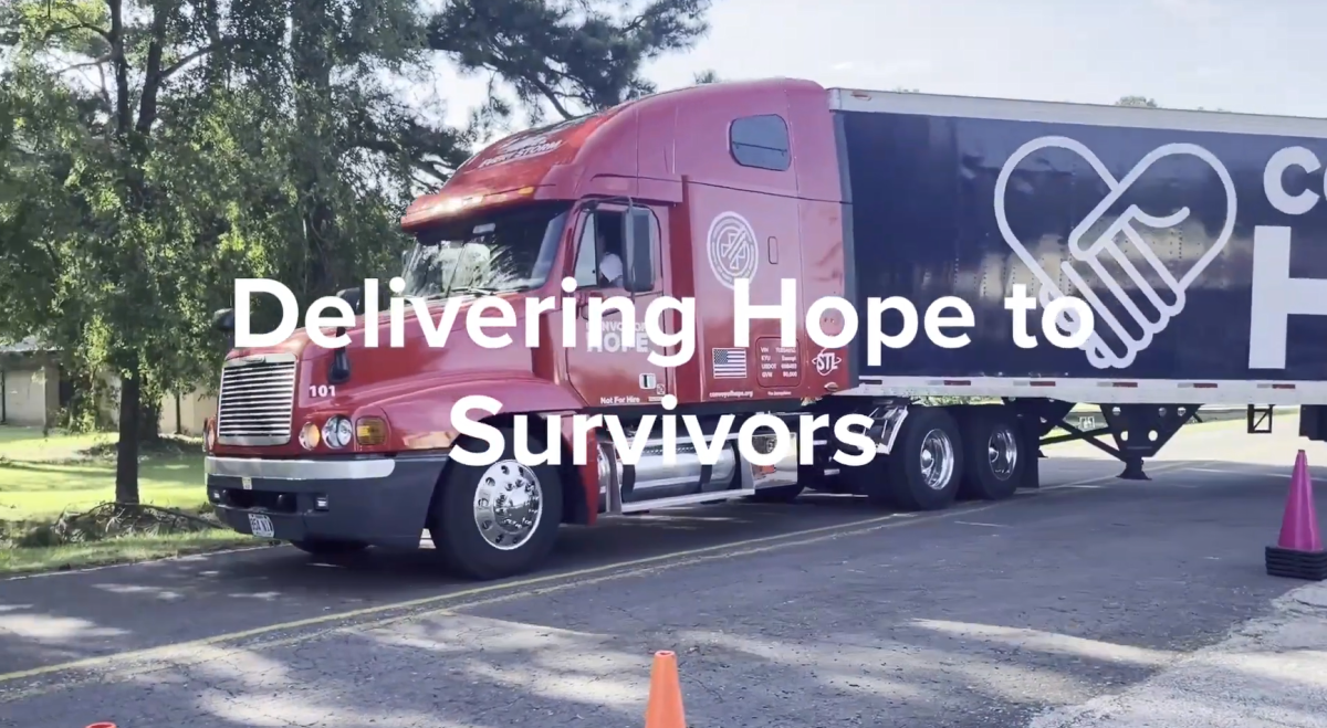 "Delivering Hope to Survivors" over a semi-truck making a turn.