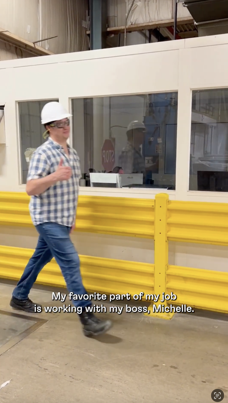 Factory worker giving thumbs up