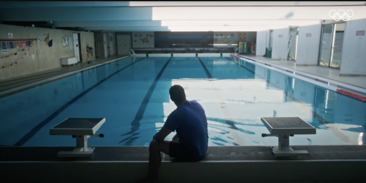 person in front of swimming pool