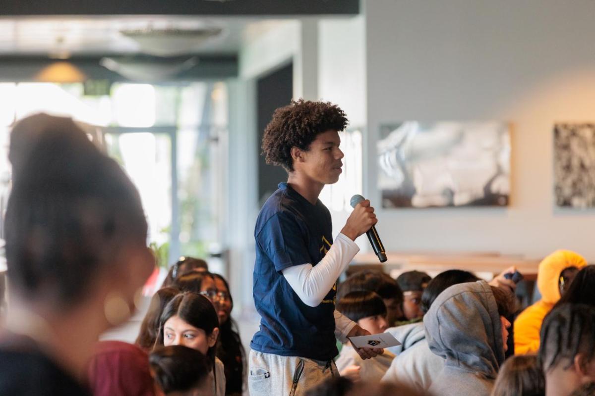 A Lakewood High School student asks the panelists a question.