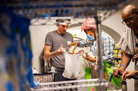 Someone picking up groceries at a food pantry