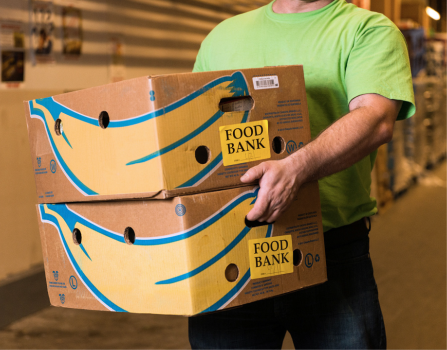 Person carrying two boxes