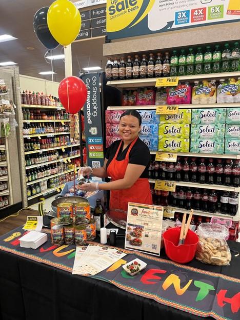 A person in an apron at a store