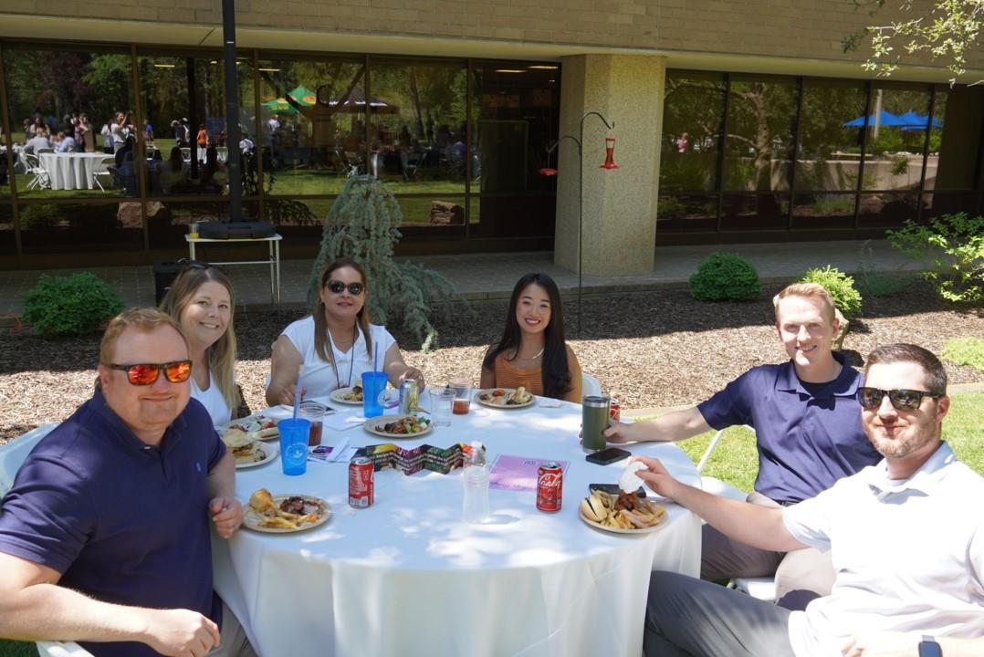 People sitting at table with food