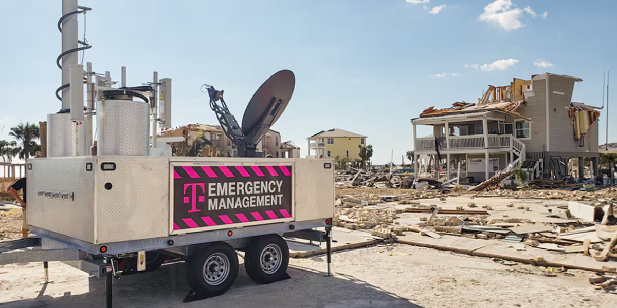 Equipment next to a damaged house