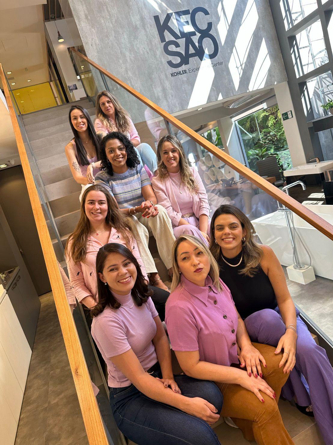 Group of women sitting on staircase