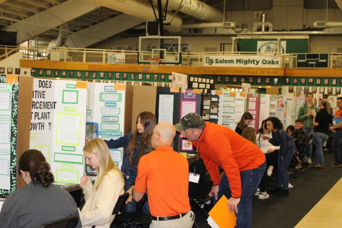 People sat at booths at the Salem County Science Fair