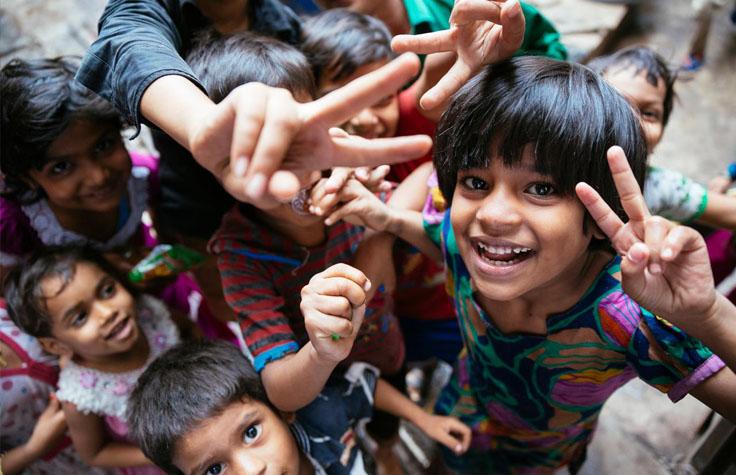 Children shown giving the V for victory sign.