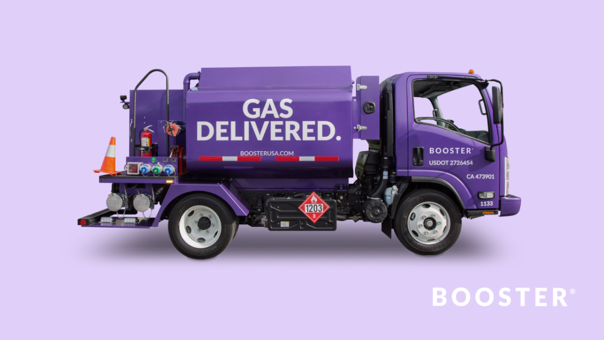 A photo of a Booster smart tanker floats on a light purple background.