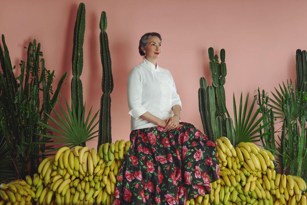 Someone posing amongst cactii and bananas