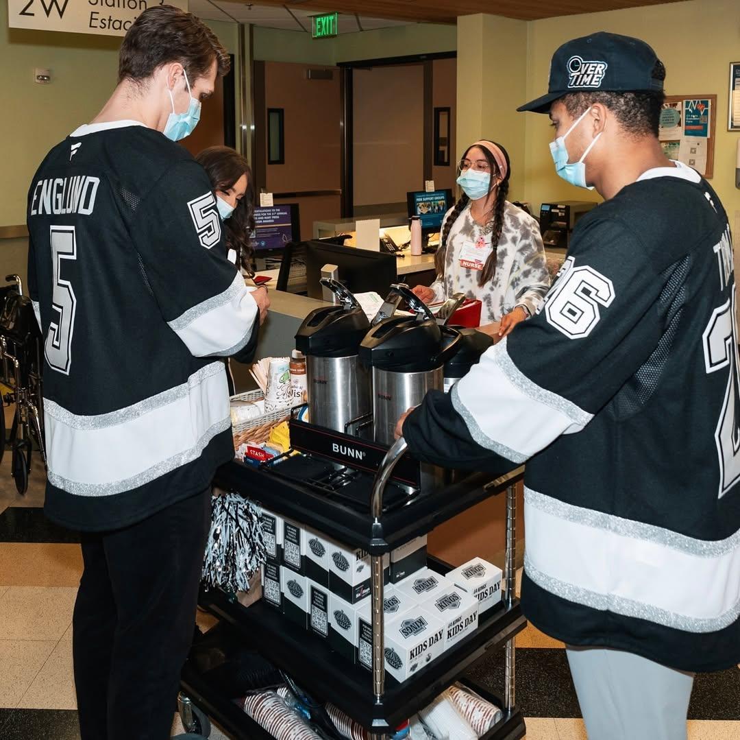 The players served the hospital staff coffee to show their gratitude.