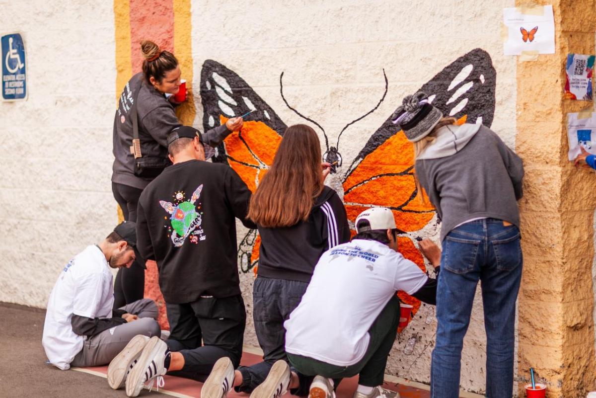 Employee volunteers from AEG painted a butterfly to brighten up the campus of 10th Street Elementary School in downtown Los Angeles.