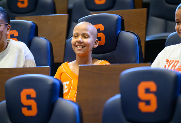 Judy shown seated at the Syracuse game.