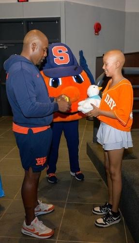 Judy with Syracuse Head Football Coach Fran Brown.