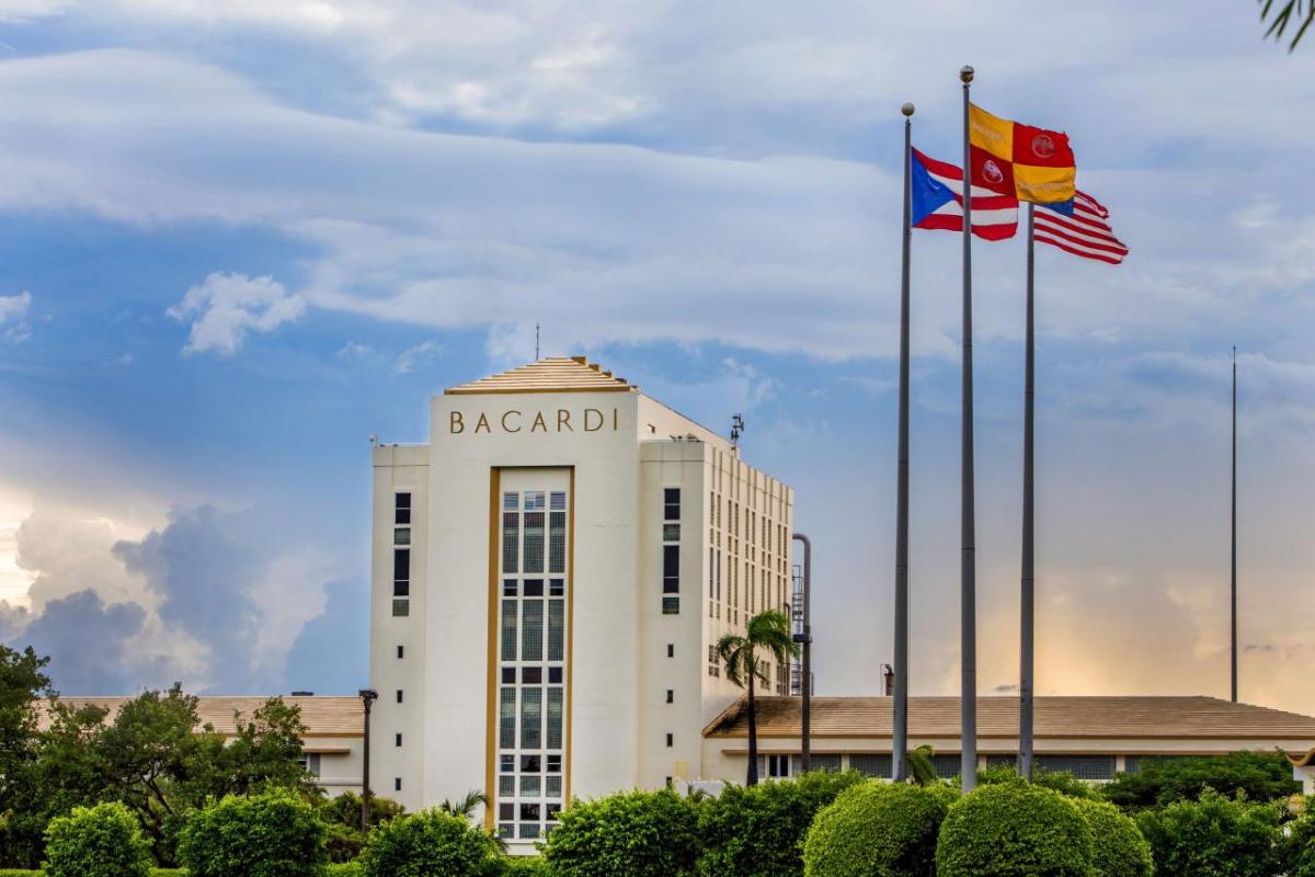 Exterior of the 'Cathedral of Rum' and three flag poles.