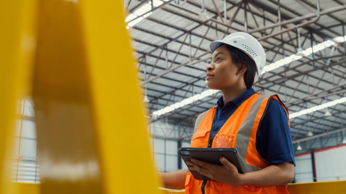 Female engineer looks out at a project