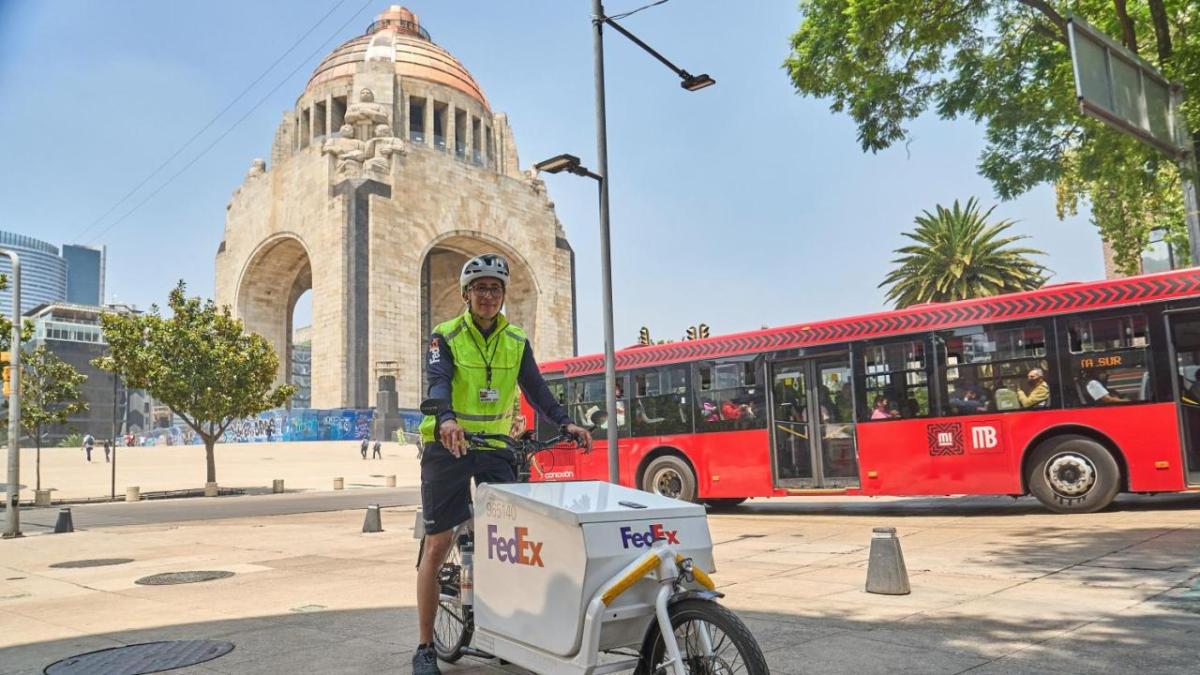 Person delivering for FedEx via bicycle