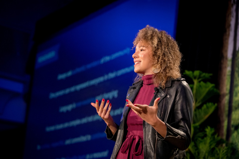 photo of Alexandra Legend Siegel speaking at a conference 