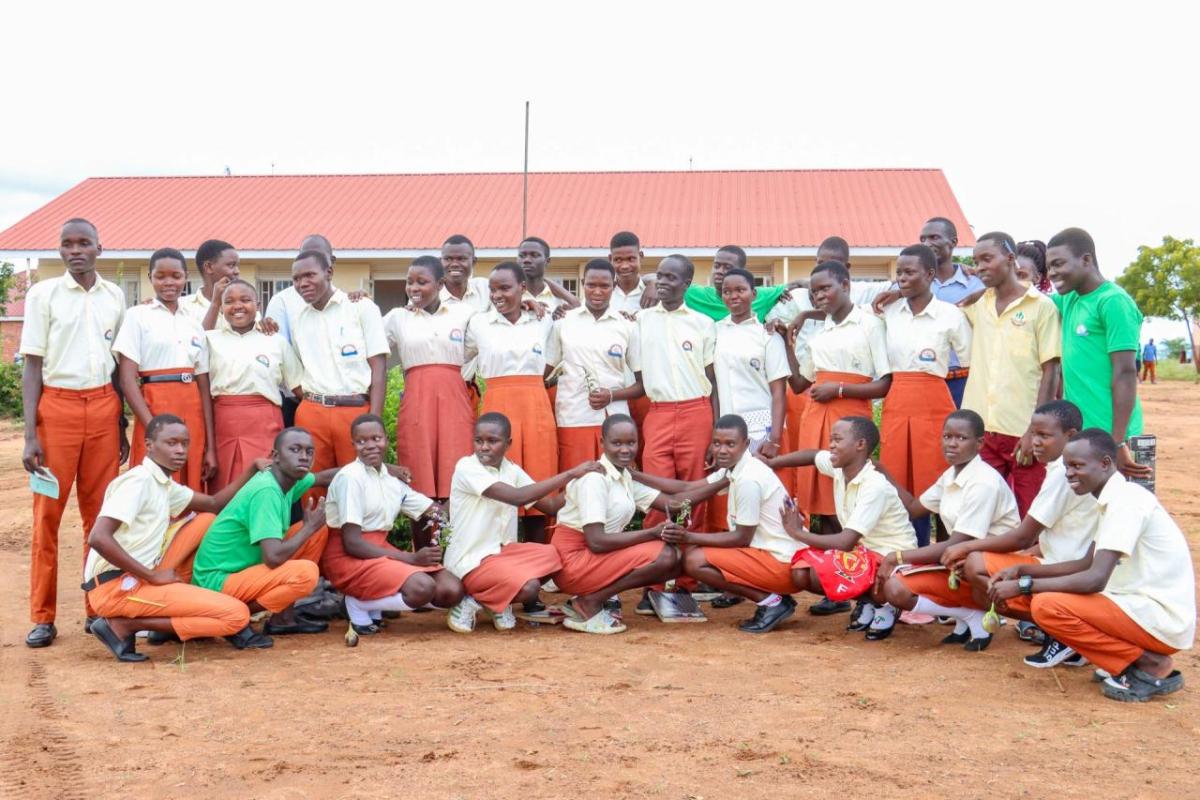 Patience and her team with their trophy from the Karamoja Green Schools regional debate. 