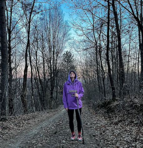 Natasa walking in a forest.