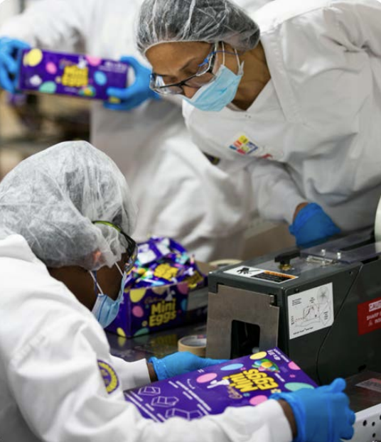 Workers packaging snacks 