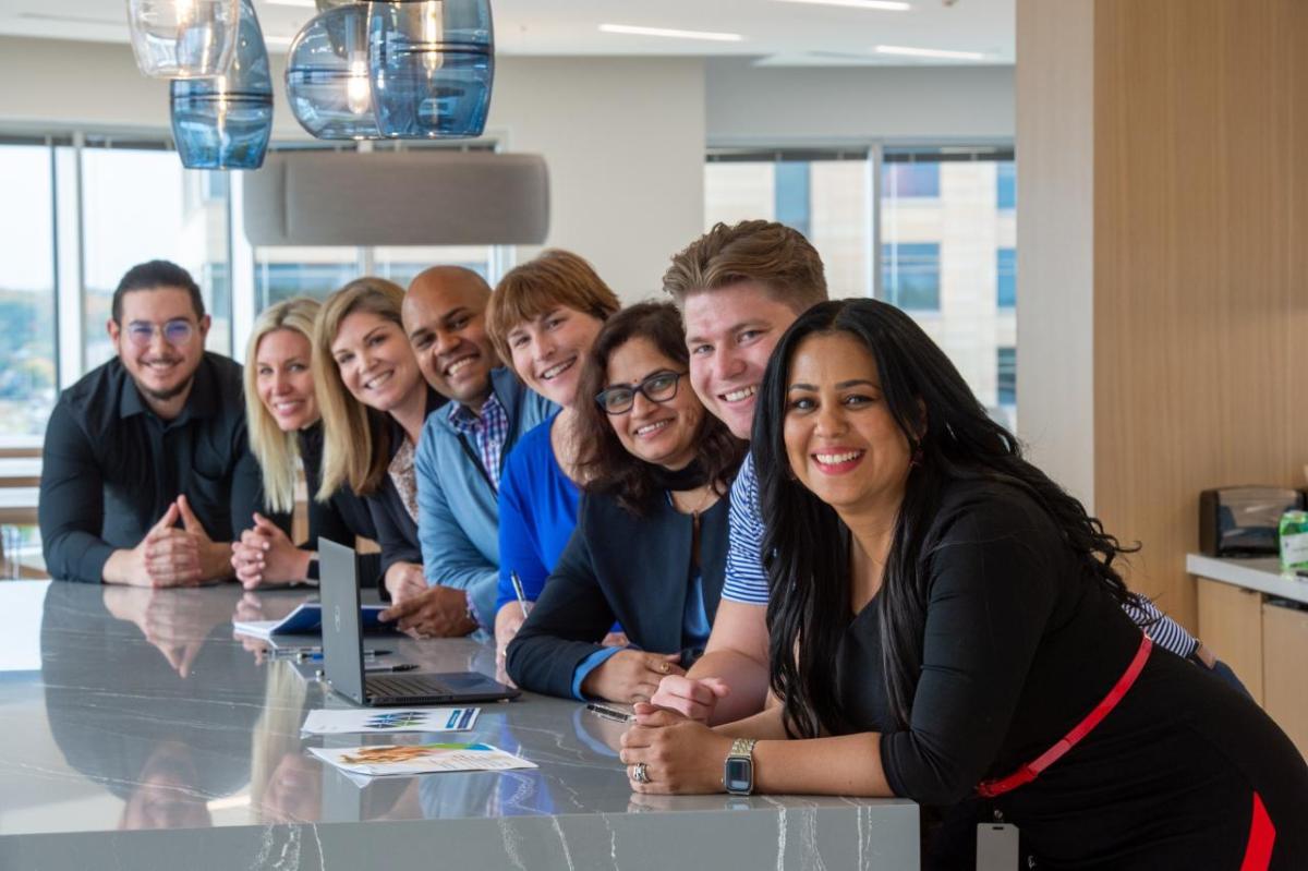 Pentair employees gather at table