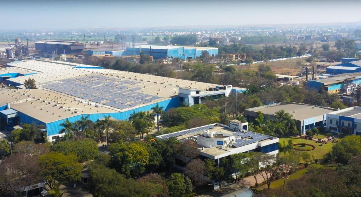 CASE Construction Equipment manufacturing plant in Pithampur, India, with solar panels on the roof