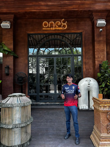 Rahul outside of a restaurant.