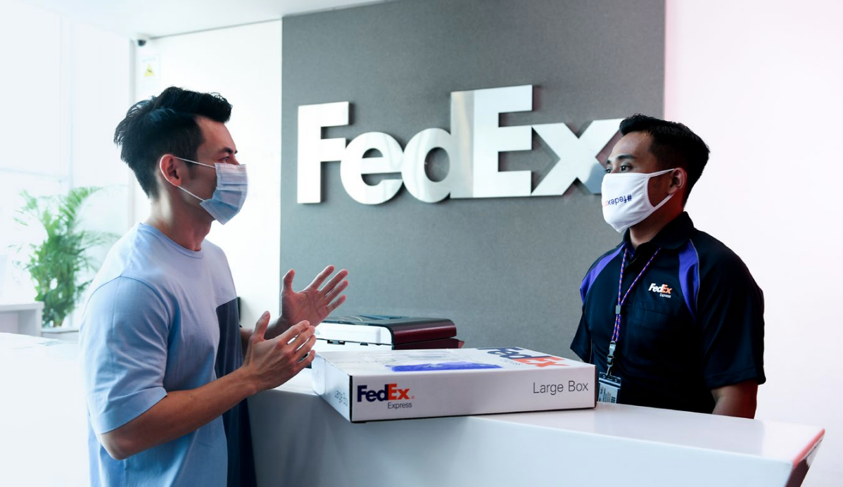 FedEx employee helping a customer