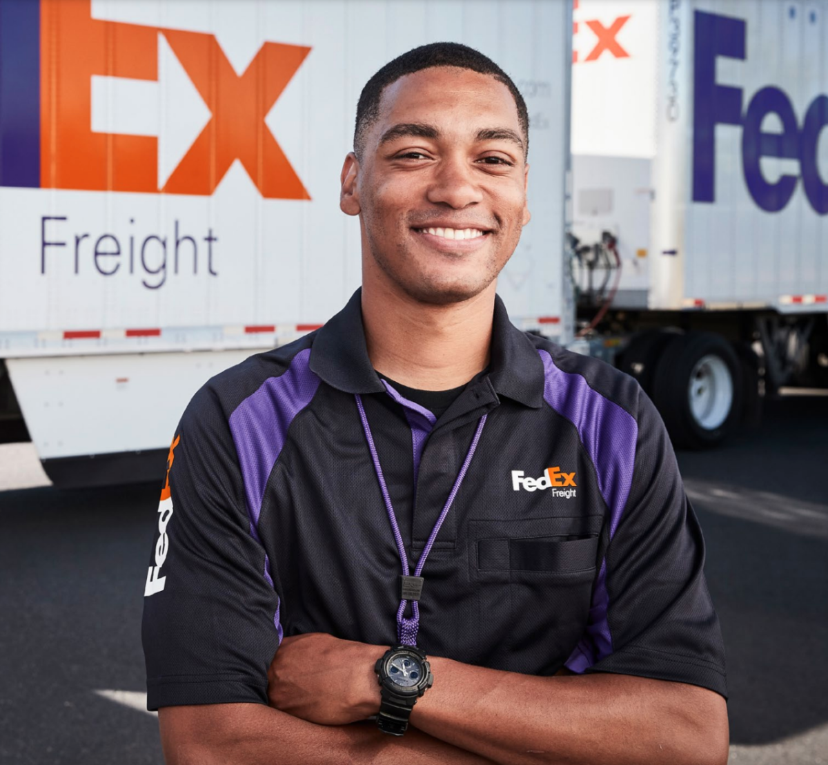 Fedex Employee smiling with arms crossed