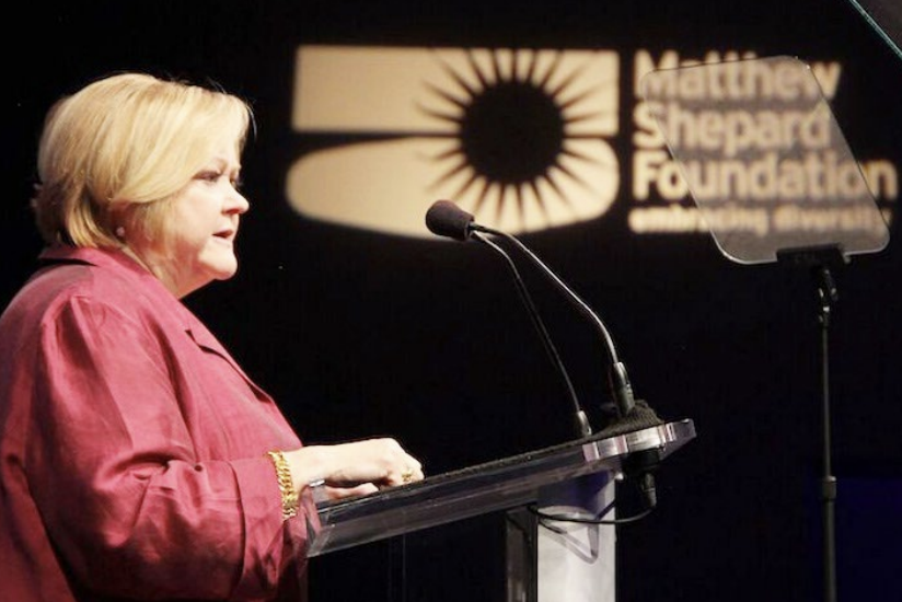 A person giving a speech at a podium 