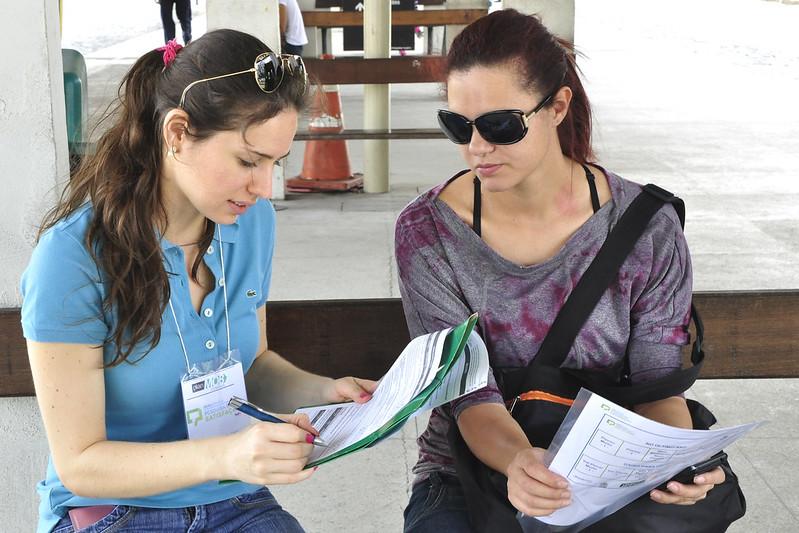 two people reviewing papers together