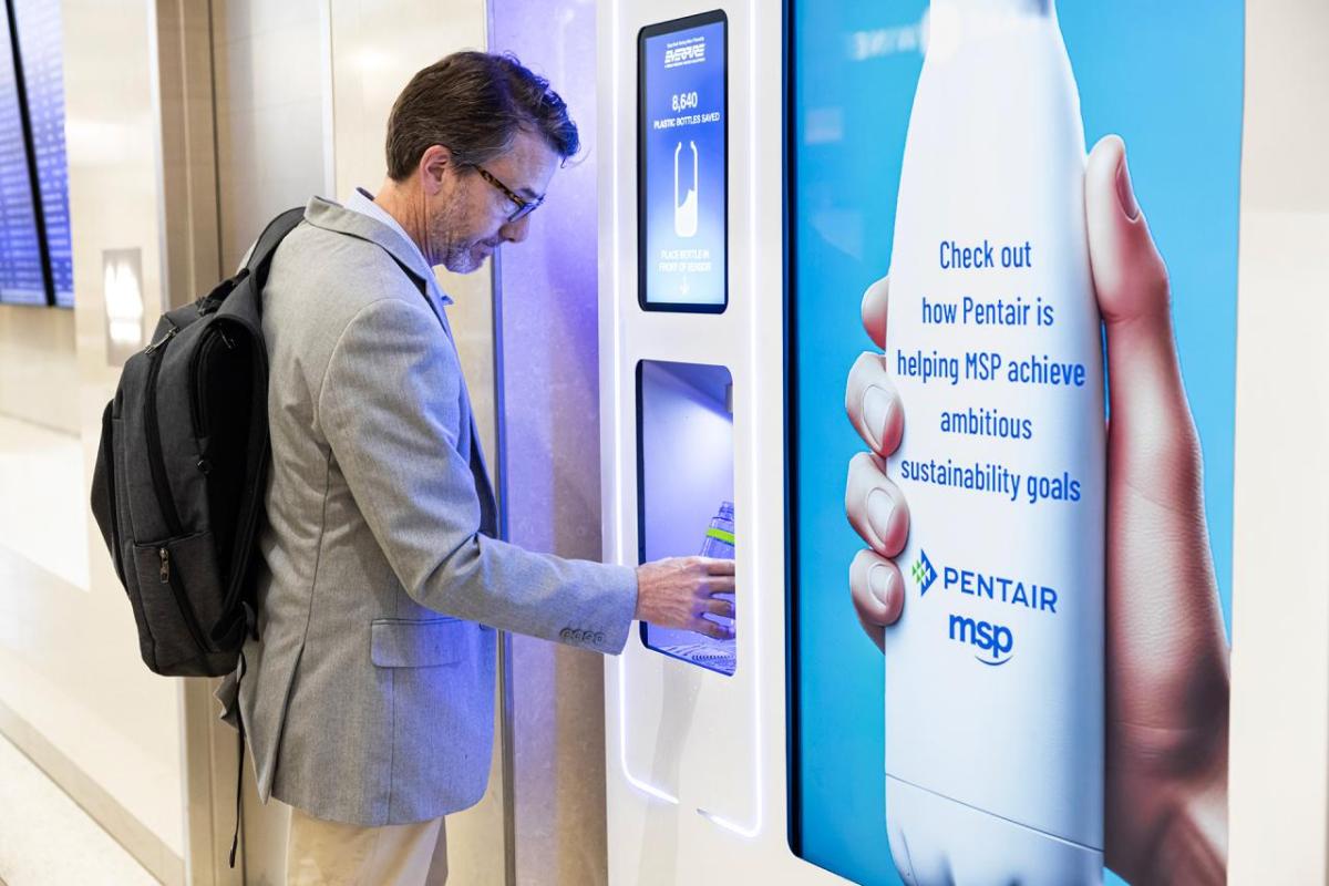 Man filling water bottle