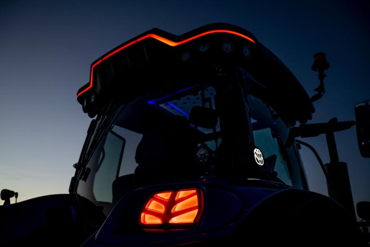 tractor's orange running lights at early dawn