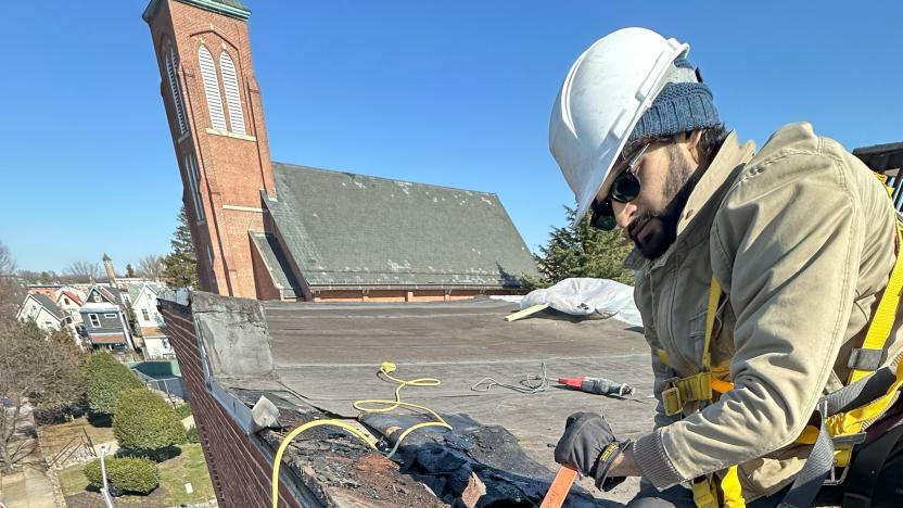 A construction worker on a roof 