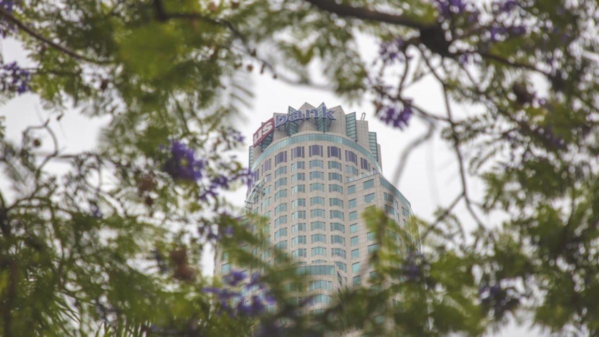 U.S. Bank tower shown through the trees.