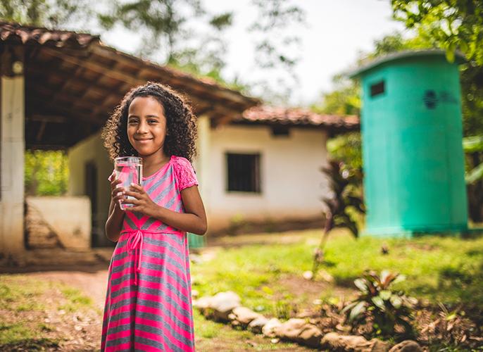 Little girl with glass of water