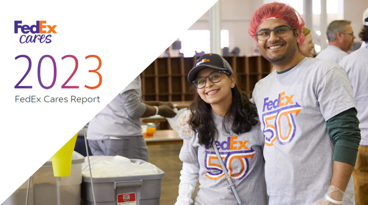 Two smiling people in "FedEx 50" t-shirts. "FedEx Cares 2023" on the side.