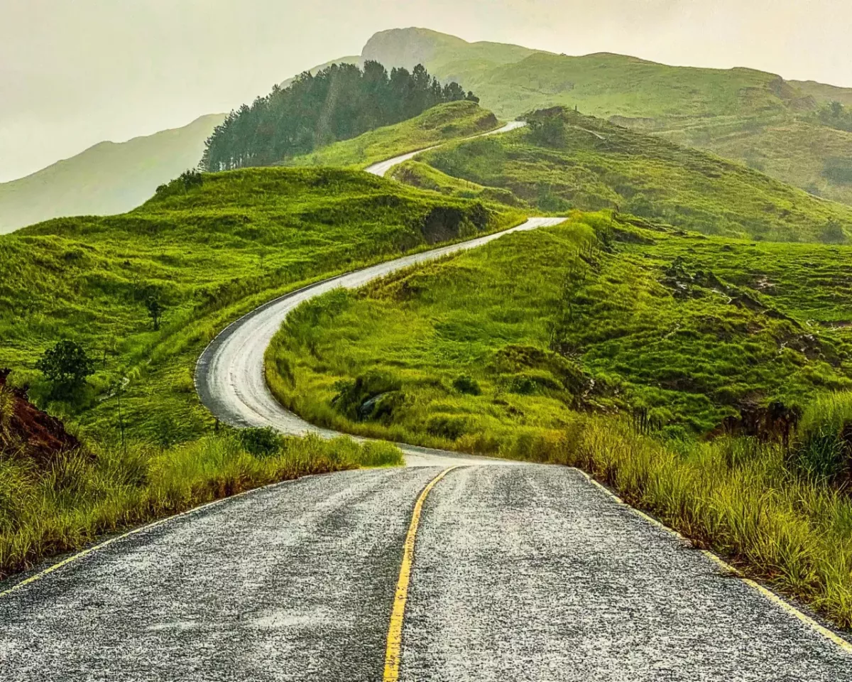 A winding road up a hilly landscape