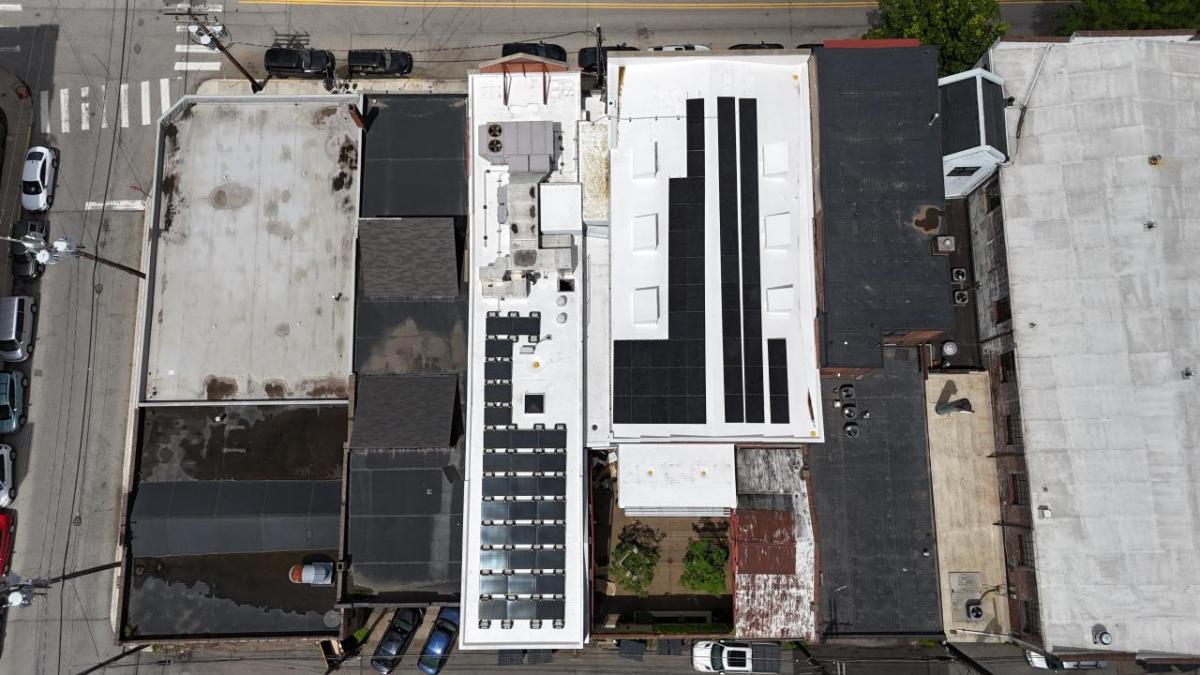 Drone view of rooftop solar array at Cancer Bridges