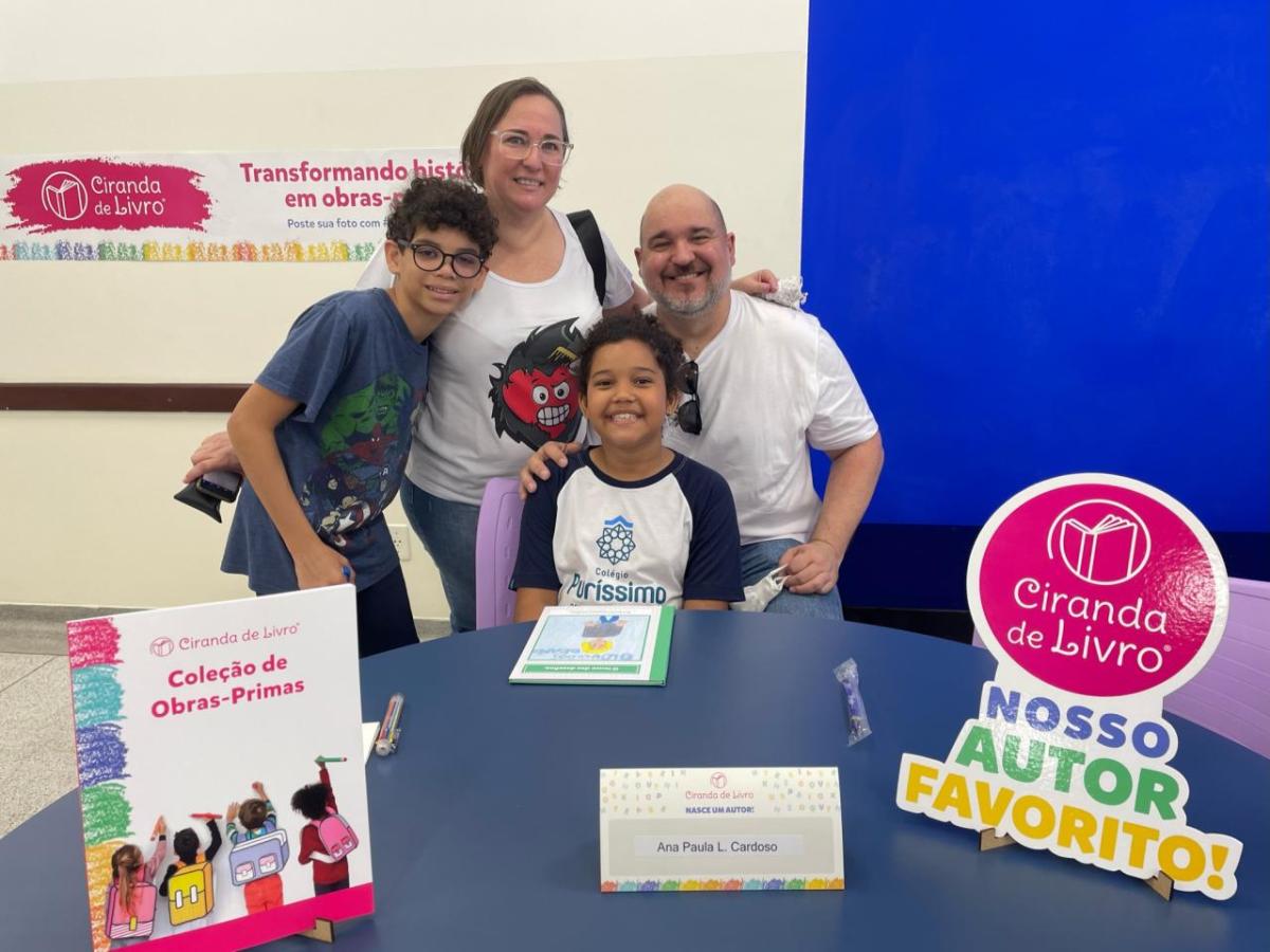 Two adults and two children sitting at a table