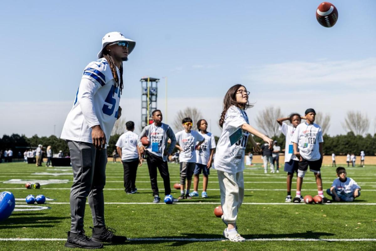Kids playing football on Field Day